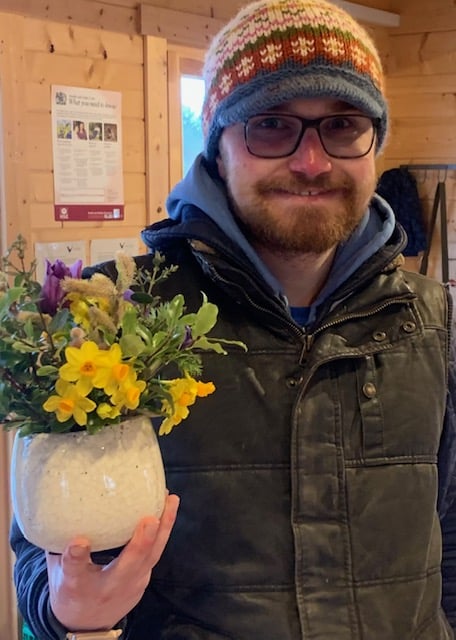 Trainee Thomas with his spring arrangement