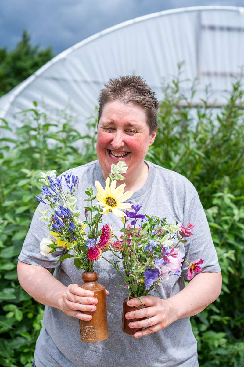 Organic Blooms trainee with flowers